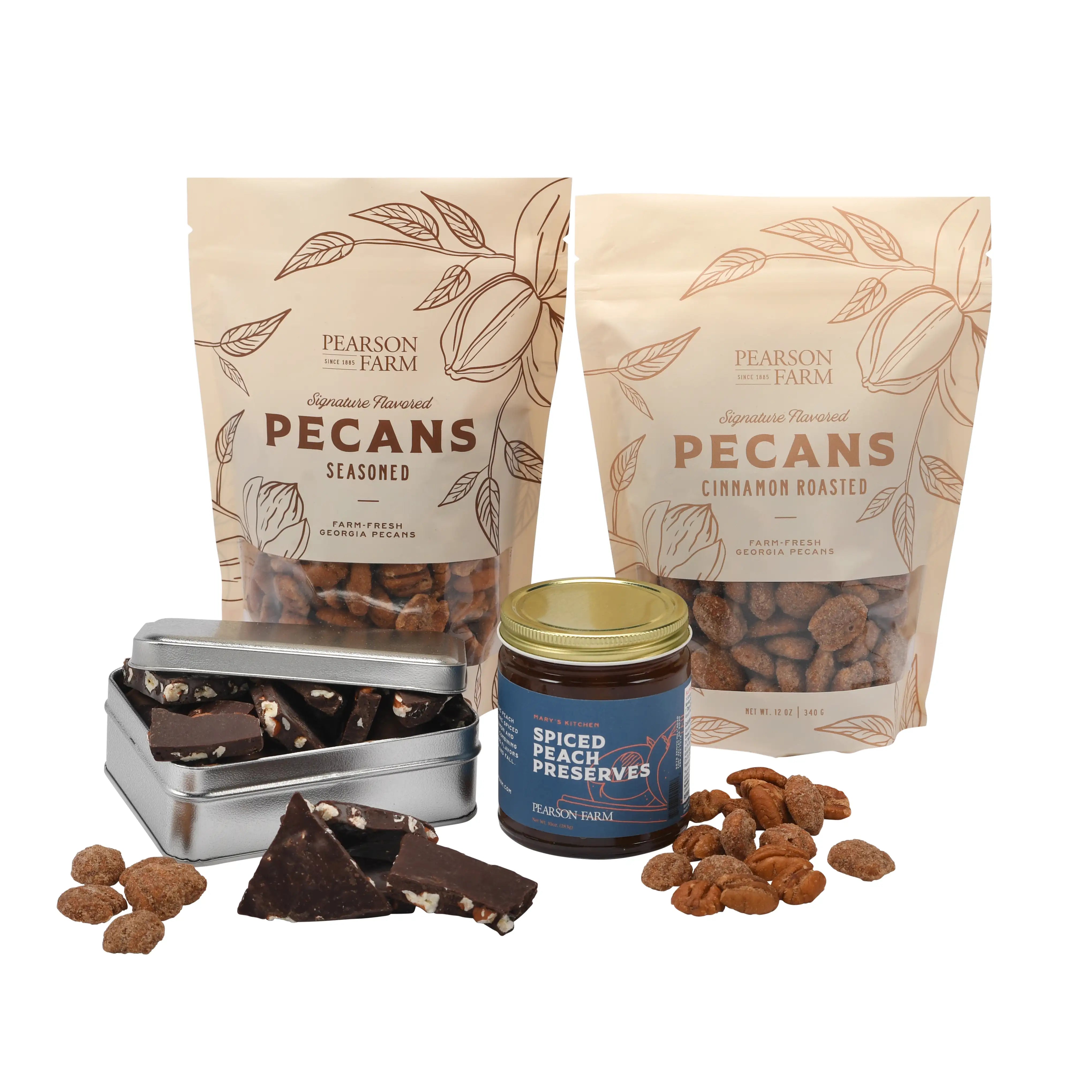 2 bags of flavored pecans, a jar of Spiced Peach Preserves, and a silver tin with dark chocolate pecan bark.