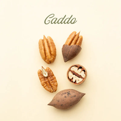 Pecans on a beige background with 'Caddo' branding.