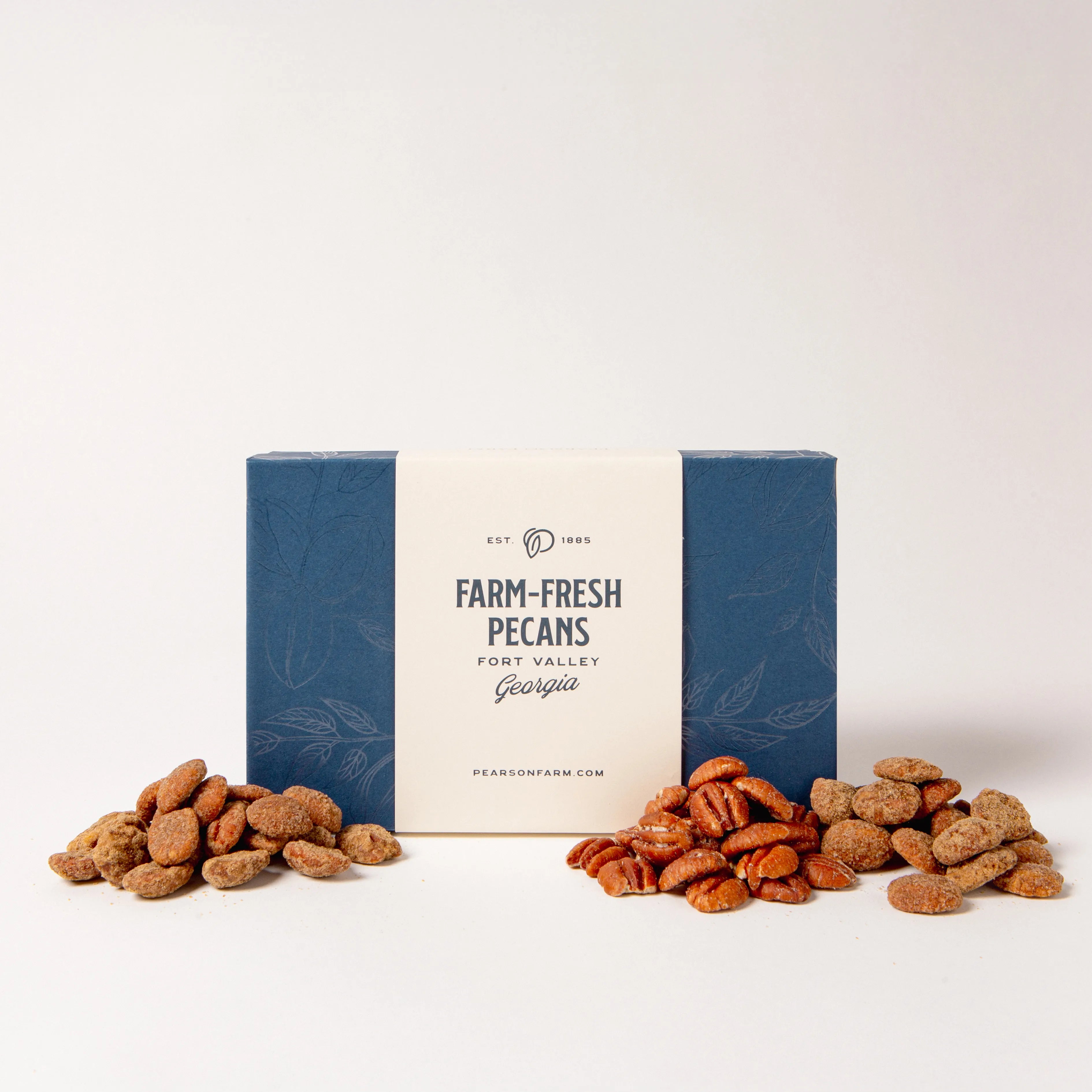 Box of 'Farm-Fresh Pecans' with pecans on a white background